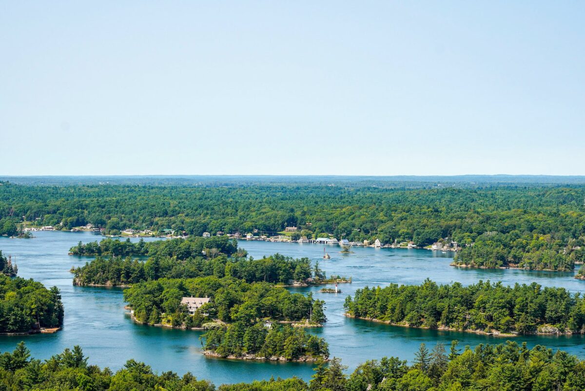 islands with green trees on body of water